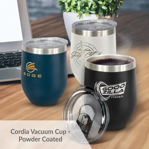 Assorted Cordia Vacuum Cups in black, white, and navy with printed logos displayed on office desk.