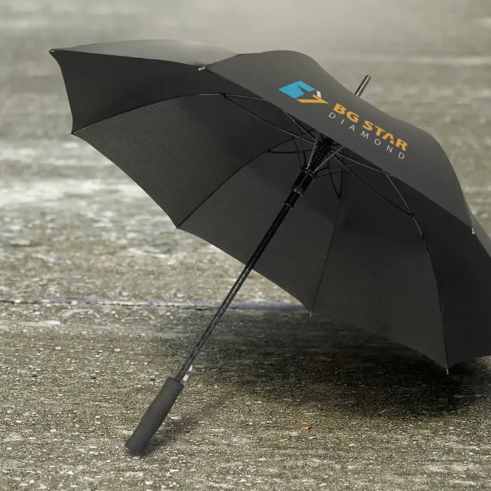 Cirrus umbrella in black with printed logo, open underside view on wet pavement
