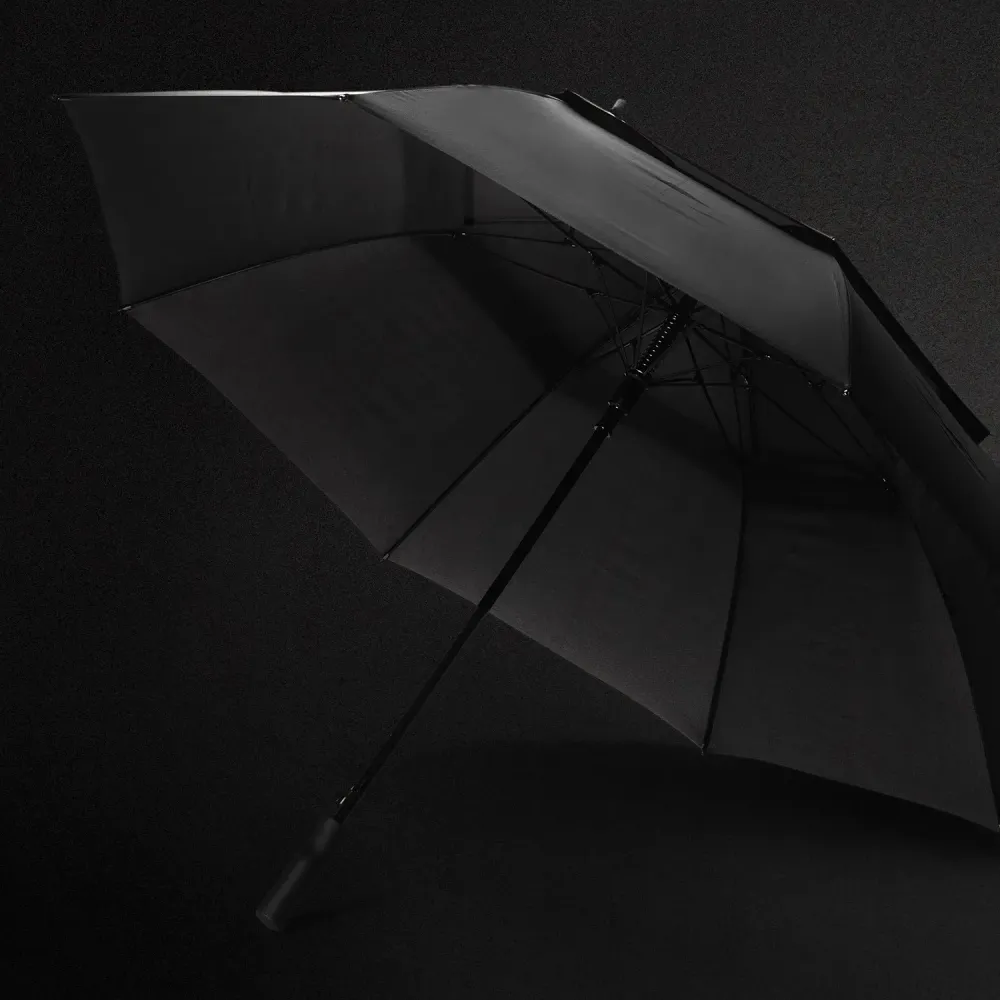 Swiss Peak Tornado 76cm Storm Umbrella in black on dark background showing premium construction and sleek storm-resistant design