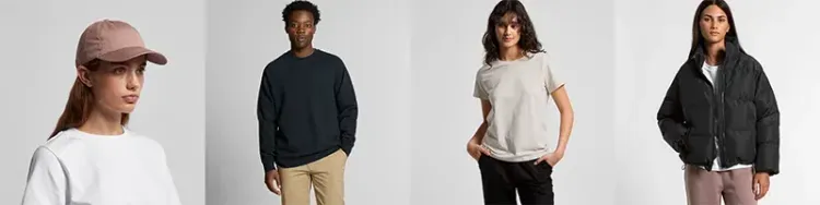 Models wearing assorted AS Colour apparel including cap, sweatshirt, T-shirt, and puffer jacket in neutral tones