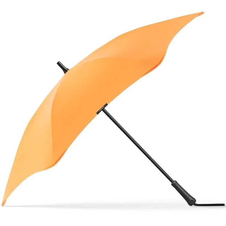 Side view of BLUNT Classic umbrella in mango orange with black handle