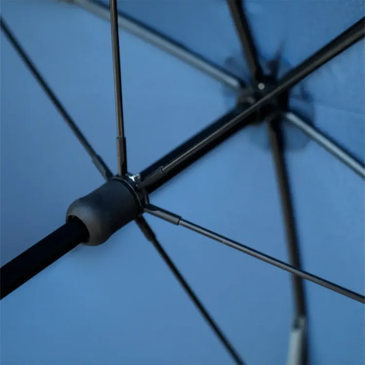 Close-up view of BLUNT Coupe umbrella frame in navy showing internal rib structure and durable construction