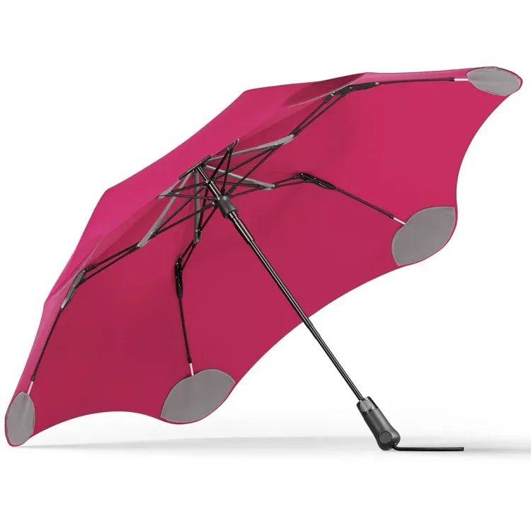 Underside view of BLUNT Metro Umbrella in pink showing six-rib frame and black handle