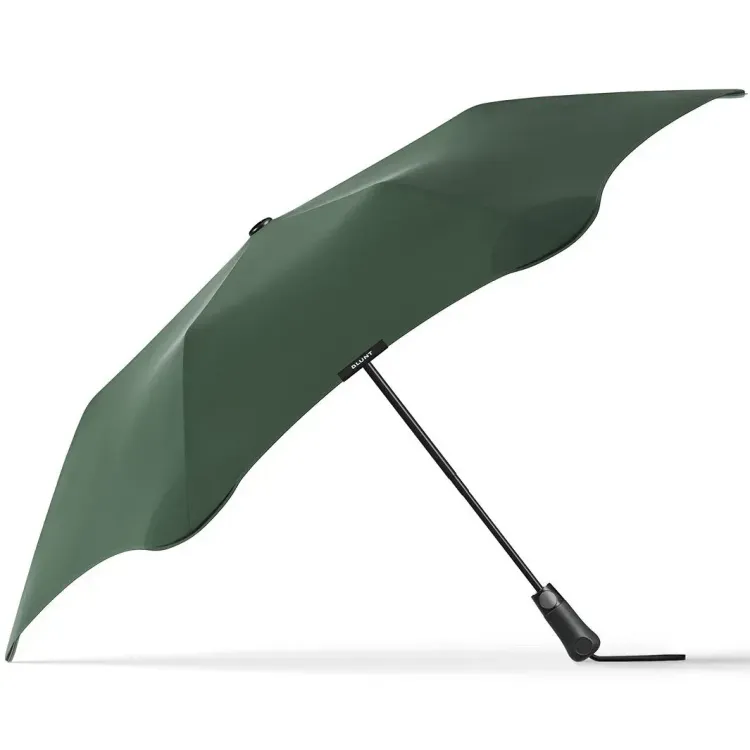 Side profile of BLUNT Metro Umbrella in forest green with black shaft and handle