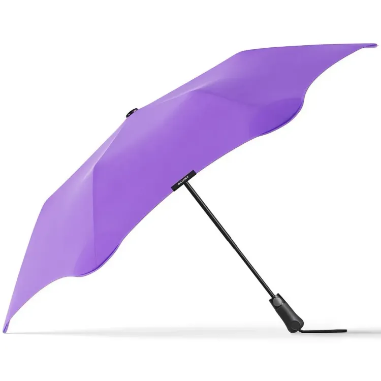 Side profile of BLUNT Metro Umbrella in purple showing canopy curve and ergonomic handle