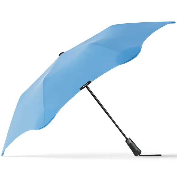 Side view of BLUNT Metro Umbrella in sky blue with black frame and handle