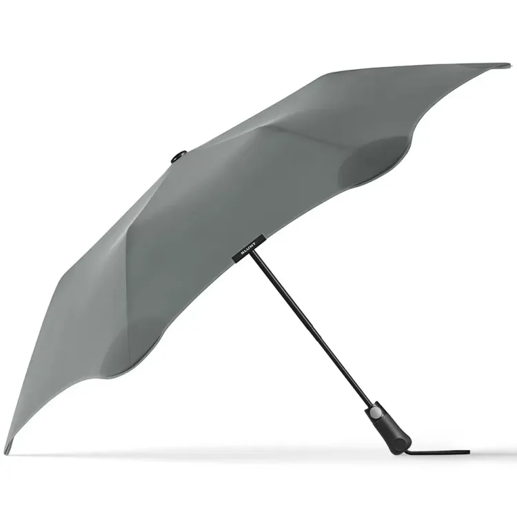 Side profile of BLUNT Metro Umbrella in storm grey showing aerodynamic canopy and slim black shaft