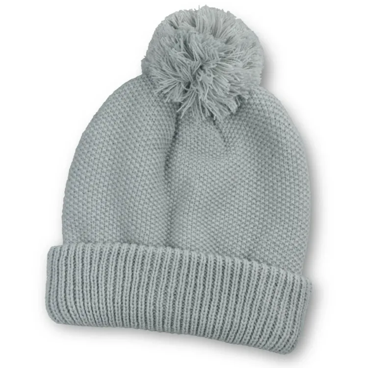 Grey Bumble Beanie with folded cuff and matching pom-pom on top.