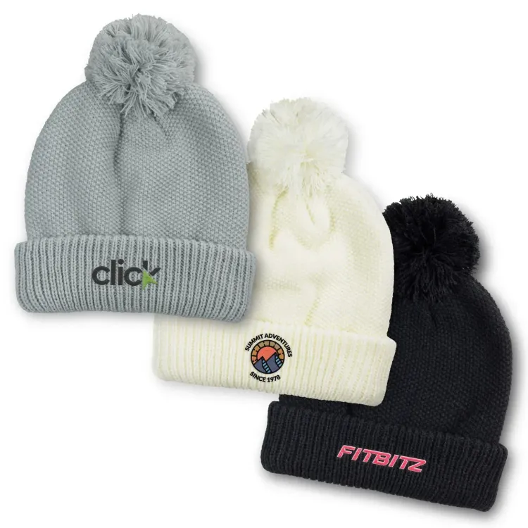 Bumble Beanies in grey, white and black with embroidered logos and pom-pom tops.