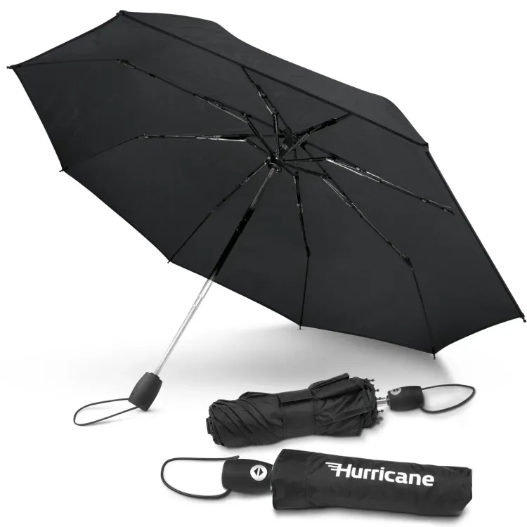 Hurricane City umbrella in black, open underside view with two closed umbrellas, one in branded sleeve