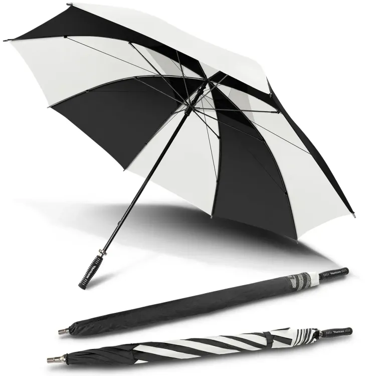 Hurricane Sport umbrella in black and white, open underside view with two closed umbrellas, one in branded sleeve