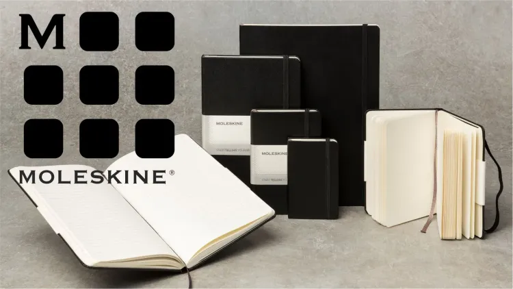 Moleskine logo with a display of black notebooks open and closed on grey background.