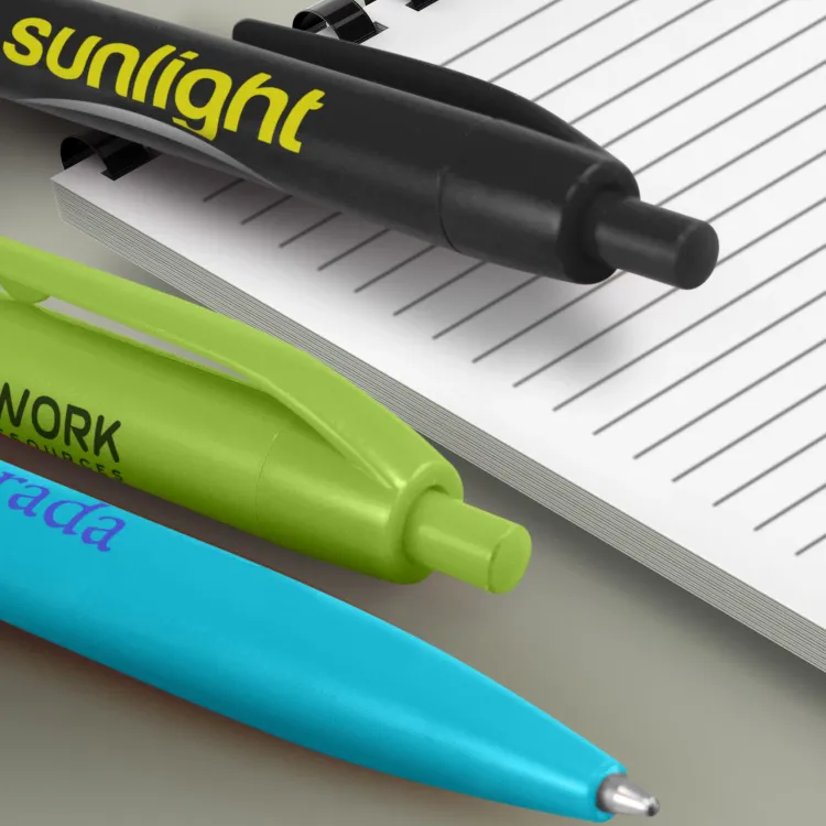 Branded Omega Pens with printed logos on lined notebook