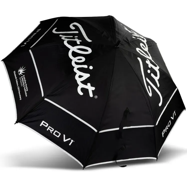 Titleist Tour Double Canopy Umbrella fully open, top view showing black canopy with bold white Titleist and PRO V1 logos