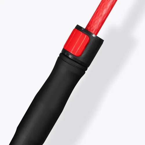 Close-up of Monsoon umbrella handle in black with red shaft and push button