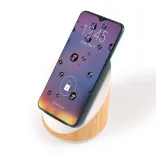 Fresco Speaker & Wireless Charger - Angle with Phone