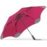 Underside view of BLUNT Metro Umbrella in pink showing six-rib frame and black handle