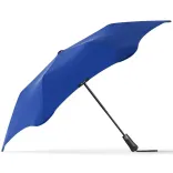 Side profile of BLUNT Metro Umbrella in ocean blue with black frame and ergonomic handle