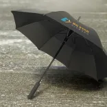 Cirrus umbrella in black with printed logo, open underside view on wet pavement