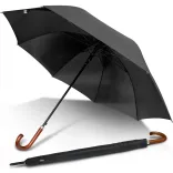 Executive umbrella in black, open underside view with wooden hook handle and matching sleeve