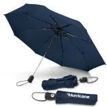 Hurricane City umbrella in navy, open underside view with two closed umbrellas, one in branded sleeve