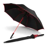 Monsoon Umbrella in black and red, open angled view with red shaft, trim and ribs