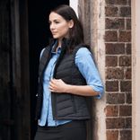 snow-lady-vests-model-in-navy-vest.jpg