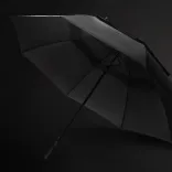 Swiss Peak Tornado 76cm Storm Umbrella in black on dark background showing premium construction and sleek storm-resistant design